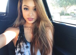 Beautiful asian girls take selfies in..